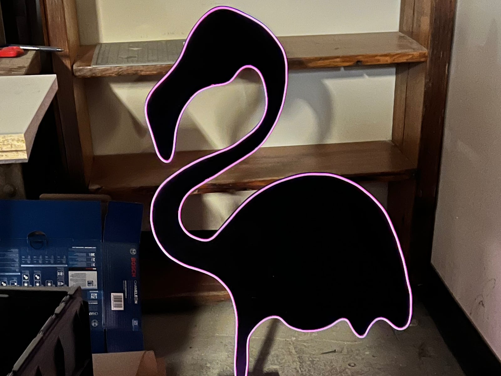 One of six flamingos in two designs, outlined in fiber-optic cable, part of a larger tropical disco build