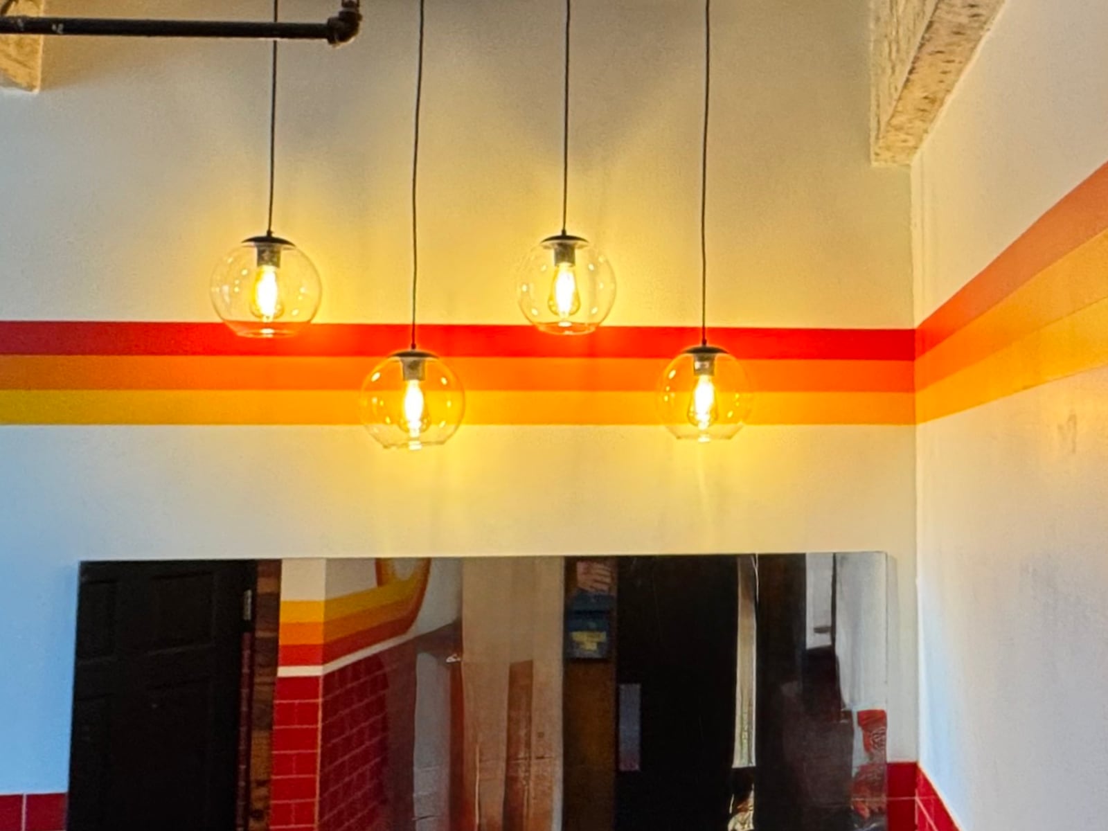 Stripes continuing around the room, with pendants I specified and installed