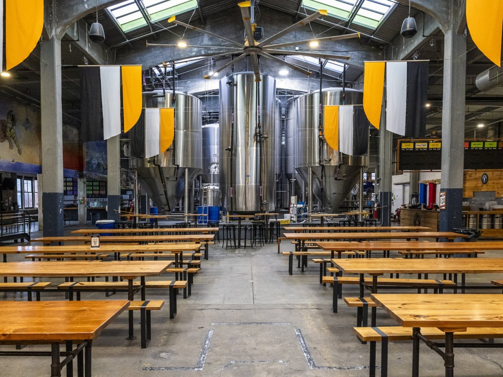 Custom 12-foot reclaimed lumber tables and benches